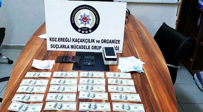 - Piyasaya sahte dolar süren zanlılara gözaltı 